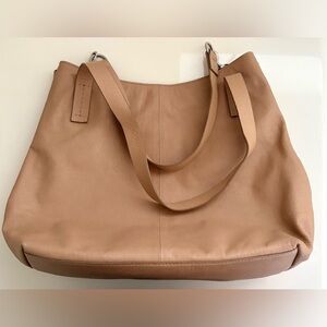 Vince Camuto Elegant Tan Leather Shoulder Bag with various compartments.
